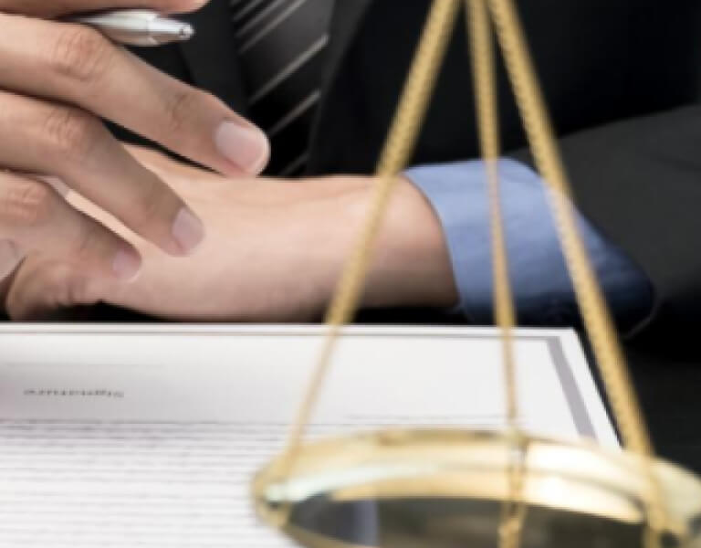 human hand with paper and one part of scales