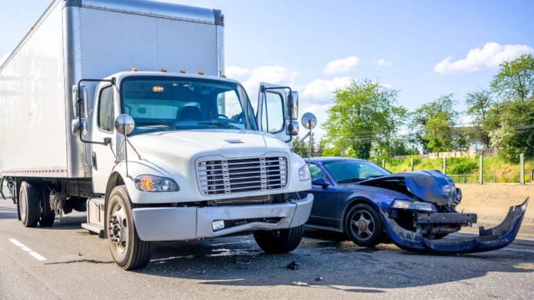 Collision between a semi-trailer and a car on the highway