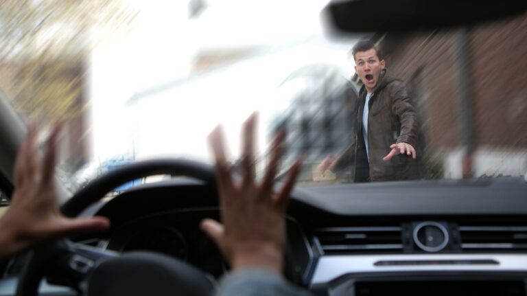 Young male pedestrian has an accident with a car