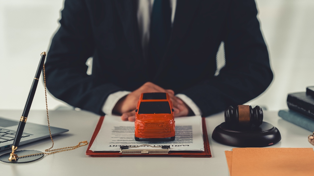 Toy car, lawyer and judge's gavel